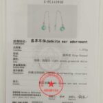 A certificate from NGTC displays Greenish-White Jadeite Donut Threader Earrings in Sterling Silver, with gemstone details, test results, official stamps, QR code, plus text in Chinese and English.