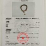A certification card for the Olive Green Nephrite Jade Wrap Bracelet – Round Beads, Convertible Necklace, includes a photo, test results, measurements, and bilingual info from the National Gemstone Testing Center (NGTC).