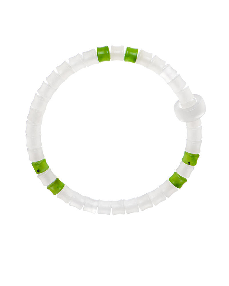 LYU_3770 The Natural White Nephrite Jade Bracelet features translucent white handmade beads with evenly spaced green accents and a small cylindrical clasp, displayed on a plain white background.