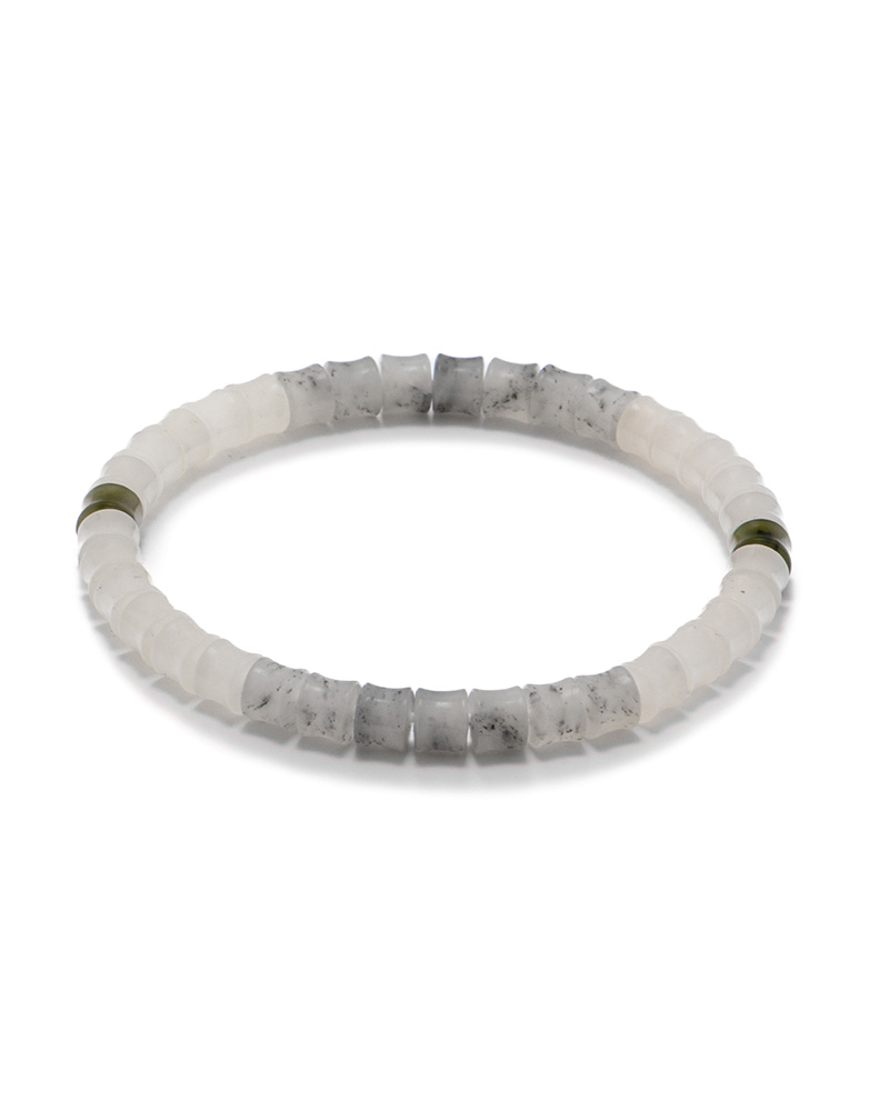 Third-party gem testing certificate photo identifying the item as a Nephrite bracelet