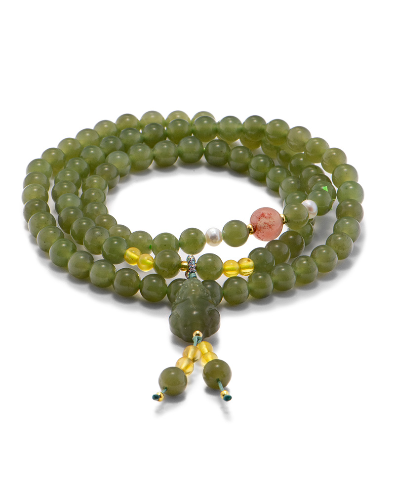 LYU_3825 Grayish-green nephrite bead multi-wrap bracelet with carved focal element and warm translucent accents on a white background.