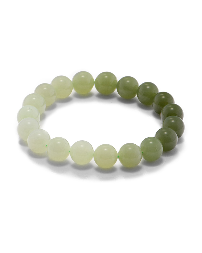 Studio photo of a white-to-olive Nephrite (soft jade) bracelet, featuring spherical beads with a smooth polish and a soft gradient strand, on a white background.