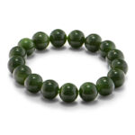 Studio photo of a deep green Nephrite (soft jade) bracelet, featuring large spherical beads with a high-gloss polish, on a white background.