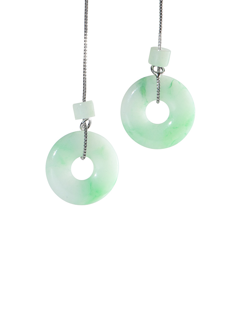 Light green jadeite donut drop earrings on high-polish sterling silver threader chains, photographed on white.