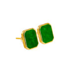 Pair of vivid green near-rectangular jadeite stud earrings in a high-polish sterling silver geometric bezel, on white background