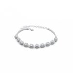Greenish white jadeite halo tennis bracelet in high-polish sterling silver