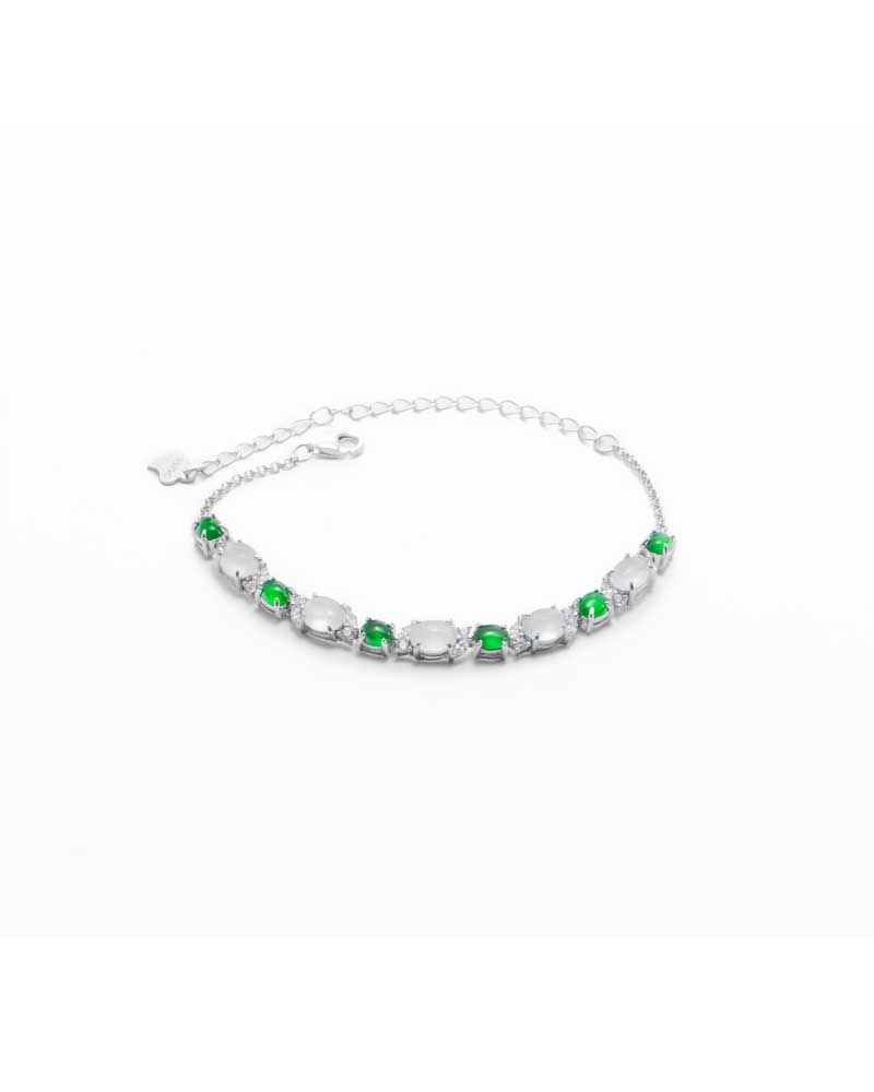 LYU_5339 Green & greenish white jadeite halo station bracelet with oval cabochons and bezel-set brilliance in high-polish sterling silver.