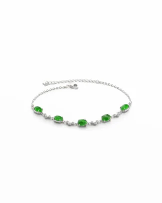 Introducing the Vivid Green Jadeite Link Bracelet — Oval Cabochons in High-Polish Sterling Silver: a delicate sterling silver bracelet showcasing five vivid green jadeite oval cabochons, each elegantly set and interspersed with small clear stones along the chain, finished with an adjustable clasp.