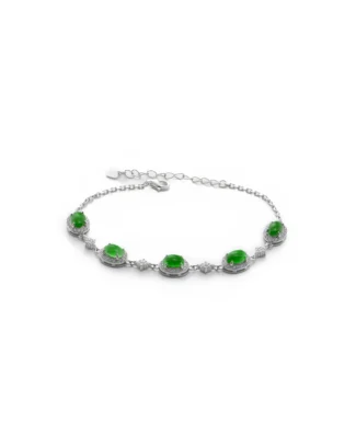 The Vivid Green Jadeite Halo Link Bracelet showcases five oval jadeite gemstones, each surrounded by sparkling clear stones, artfully linked with delicate silver connectors and secured with a lobster clasp.