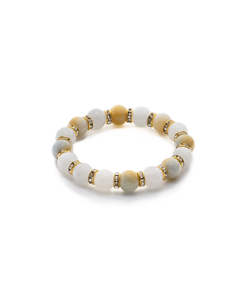 A beaded bracelet featuring alternating white and yellow round stones with small gold and rhinestone spacer beads between each stone, arranged in a circular pattern.