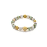 light green, greenish white, brownish yellow jadeite bracelet showing spherical beaded bracelet with a compact multicolor rhythm