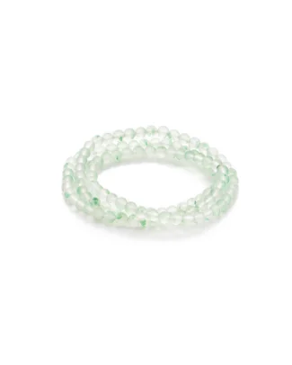 A coiled bracelet made of translucent, light green round beads, arranged in multiple loops, displayed on a plain white background.