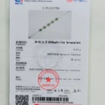 A jewelry testing certificate for a nephrite bracelet, featuring a photo of a silver and green marquise cabochon bracelet, with gemstone details, official stamps, and testing information in both Chinese and English.