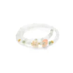 white, light green quartzite jade bracelet showing beaded necklace with a soft carved ring accent and warm-toned focal details