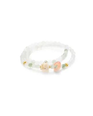 white, light green quartzite jade bracelet showing beaded necklace with a soft carved ring accent and warm-toned focal details