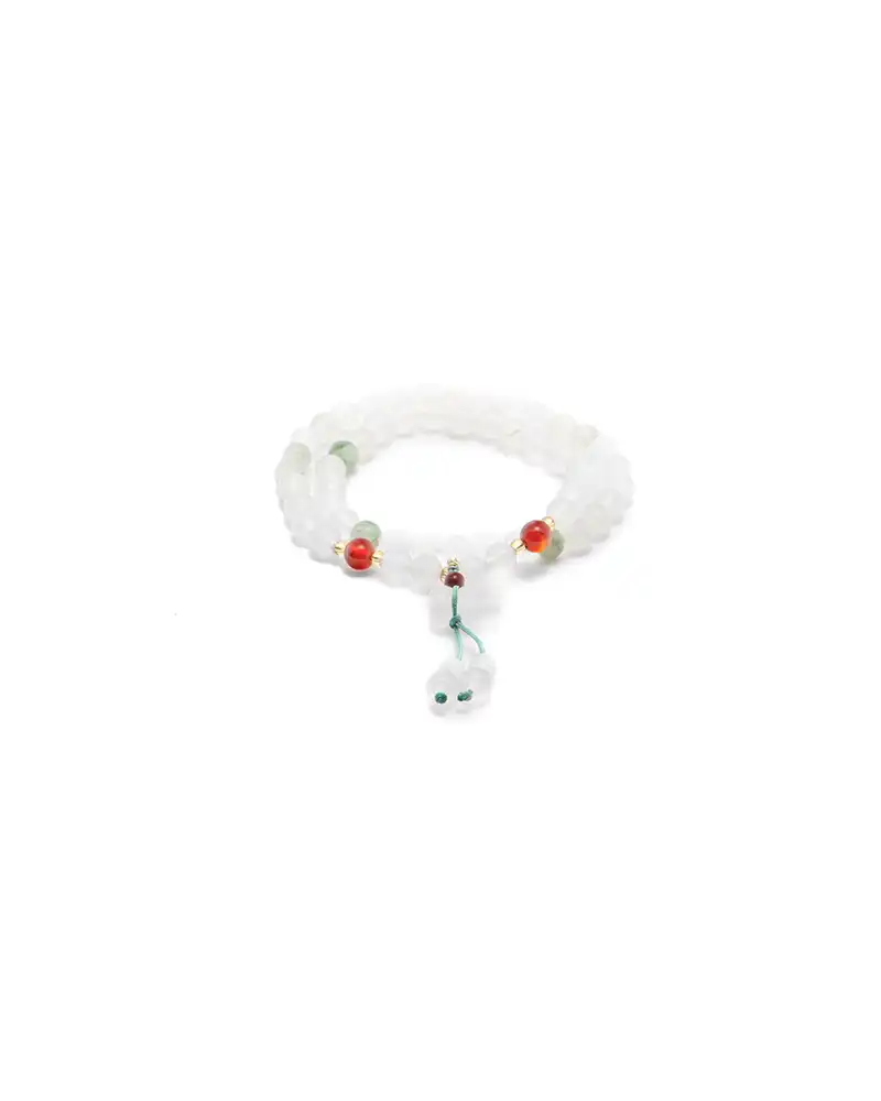 white, light green quartzite jade necklace showing long beaded necklace with a double-drop tassel detail