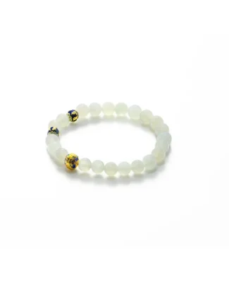 Light green Jadeite bracelet with spherical beads detail on white background