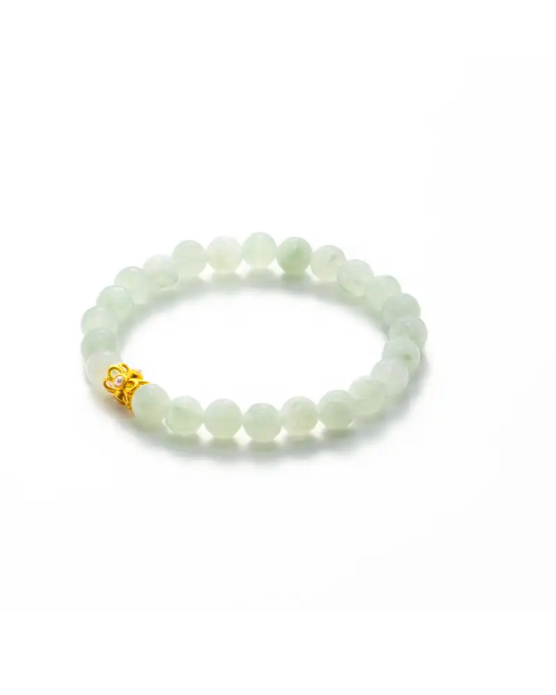LYU_5628 A jade bead bracelet with round, pale green beads and a single small gold accent piece, displayed on a white background.