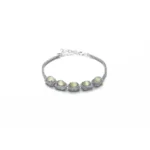 Grayish white Nephrite Jade bracelet with marquise cabochon detail on white background
