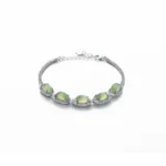 Grayish white Nephrite Jade bracelet with oval cabochon detail on white background