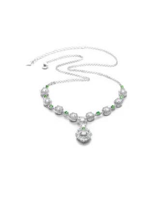 White jadeite necklace with oval cabochons and green accents on white background