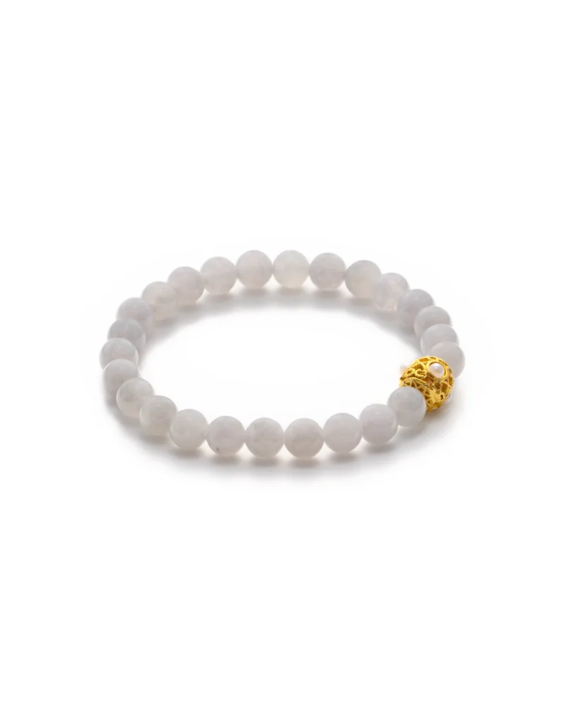 The Greenish-White Jadeite Bead Bracelet — Spherical Beads with Warm-Tone Accent features round, pale greenish-white jadeite beads and a single ornate gold accent, displayed on a white background.
