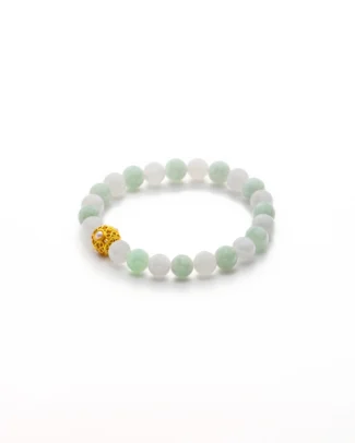 A beaded bracelet with alternating light green and white jade beads, featuring a single gold filigree bead, displayed on a white background.