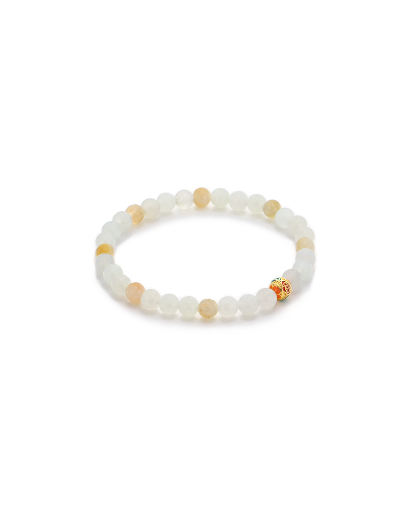 DSC_0505 拷贝 A beaded bracelet made of white and light yellow round stones, featuring one gold-colored bead with a small red accent, displayed on a white background.