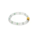 A beaded bracelet made of alternating pale green and white round beads, featuring a single gold-toned decorative bead.