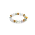 A beaded bracelet with alternating white, green, and brown round beads, featuring a single gold-colored bead with an engraved design, displayed on a white background.