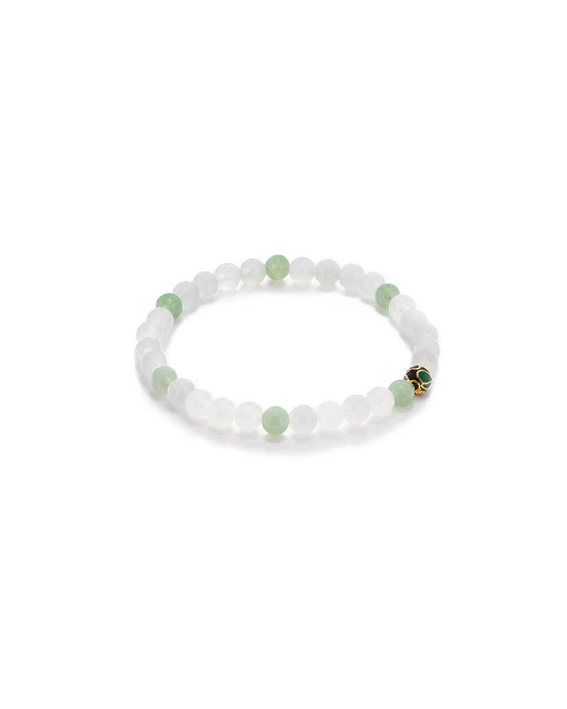 DSC_0509 拷贝 A beaded bracelet made of alternating white and light green round beads, featuring a small gold accent bead with a black design. The bracelet is arranged in a circular shape on a white background.