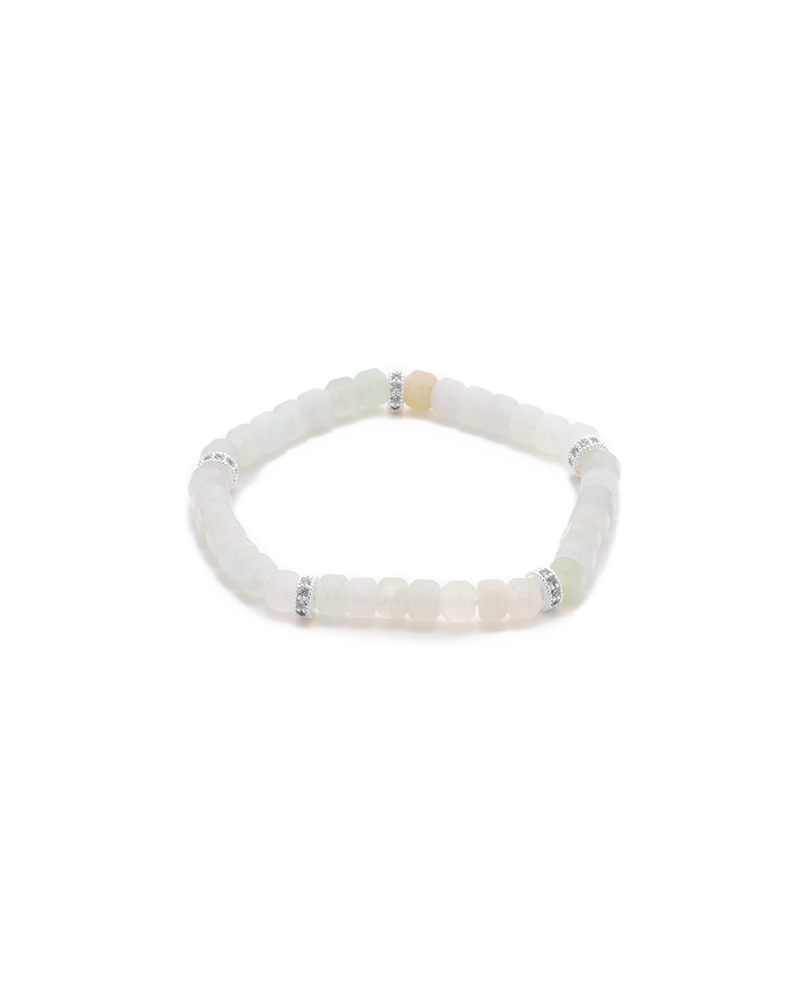 DSC_0514 拷贝 A beaded bracelet made of translucent, square white and pale yellow beads, with small silver spacer beads evenly distributed around the band. The bracelet is arranged in a circular shape on a white background.