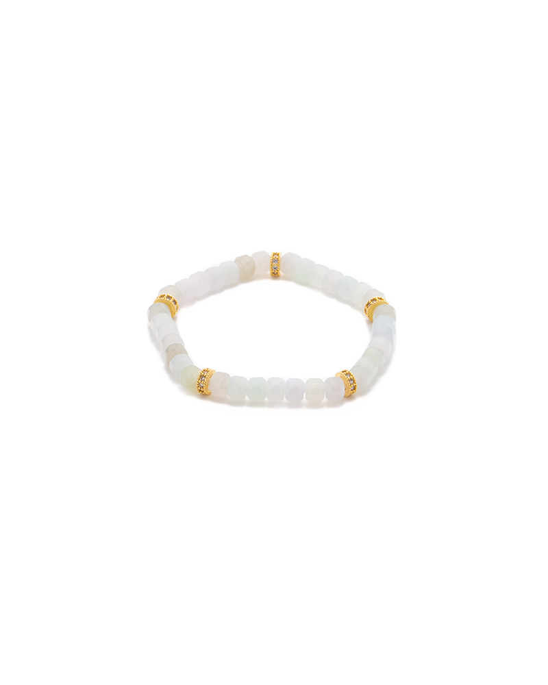 DSC_0515 拷贝 A beaded bracelet made of translucent white stones with four gold accent spacers evenly placed around it, displayed on a white background.