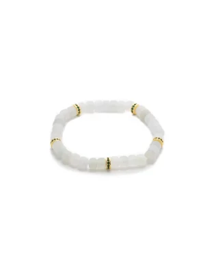 A beaded bracelet made of translucent white square beads, accented with small gold and green spacer beads, displayed on a plain white background.