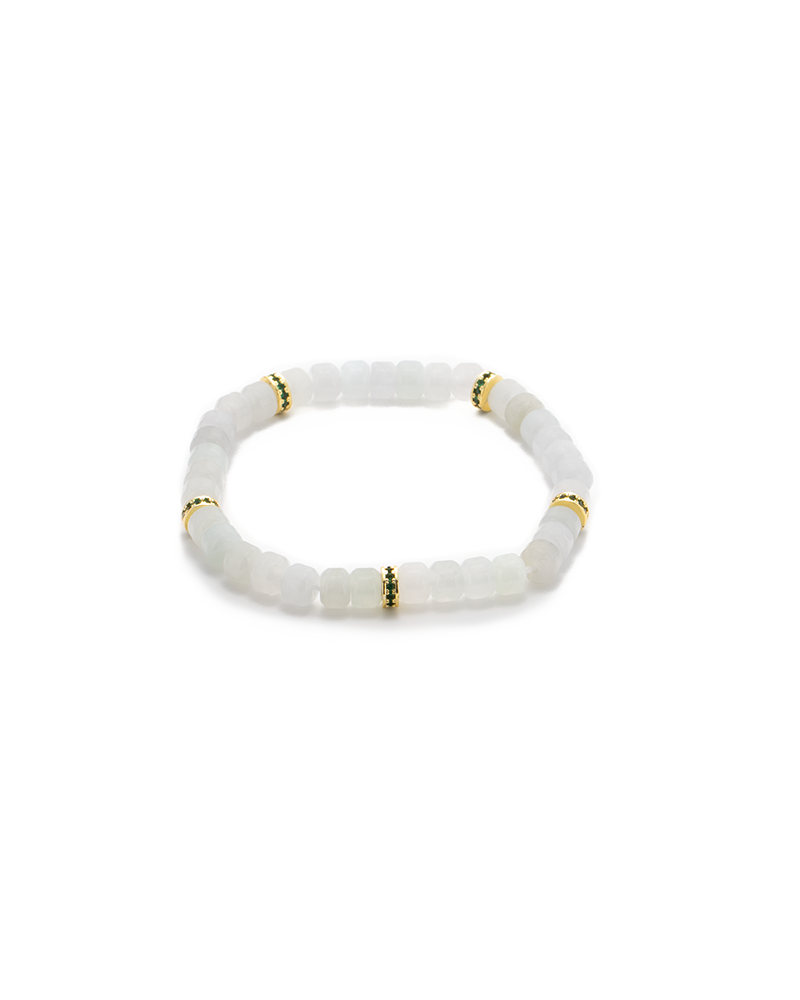 DSC_0517 拷贝 A beaded bracelet made of translucent white square beads, accented with small gold and green spacer beads, displayed on a plain white background.
