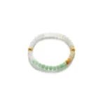A beaded bracelet featuring light green, white, and pale yellow stones, accented with two small gold decorative spacers, displayed on a white background.