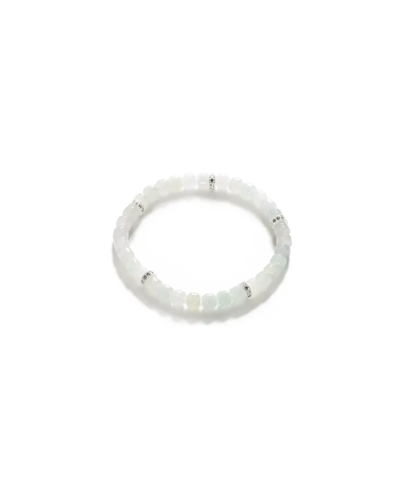 DSC_1114 拷贝 A beaded bracelet made of translucent white stones, accented with small silver spacer beads, displayed on a plain white background.