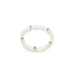 A white beaded bracelet with translucent round beads, accented by four gold rings spaced evenly around the band, displayed on a plain white background.
