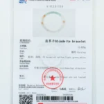 An official gem testing certificate displaying details and a photo of a jadeite bracelet with light green, white, and brownish-yellow tones. The certificate includes text, stamps, QR code, and security features.