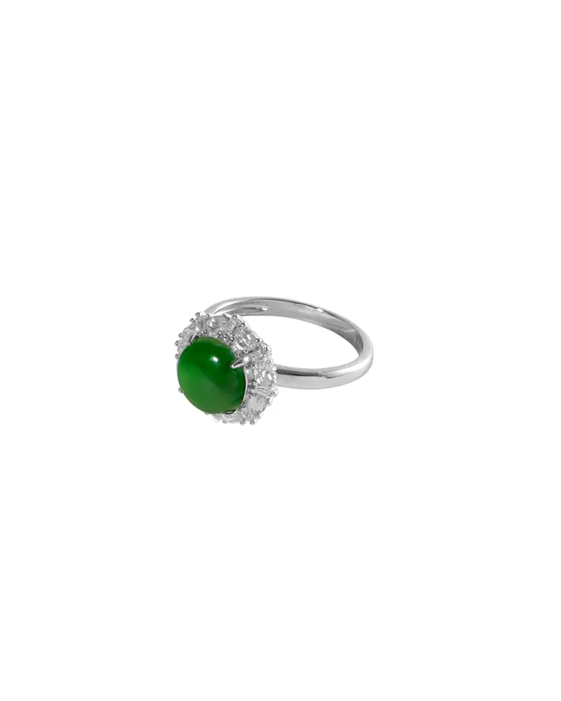 LYU_5231 拷贝 A silver ring featuring a prominent oval green gemstone at the center, surrounded by small clear stones, displayed on a white background.