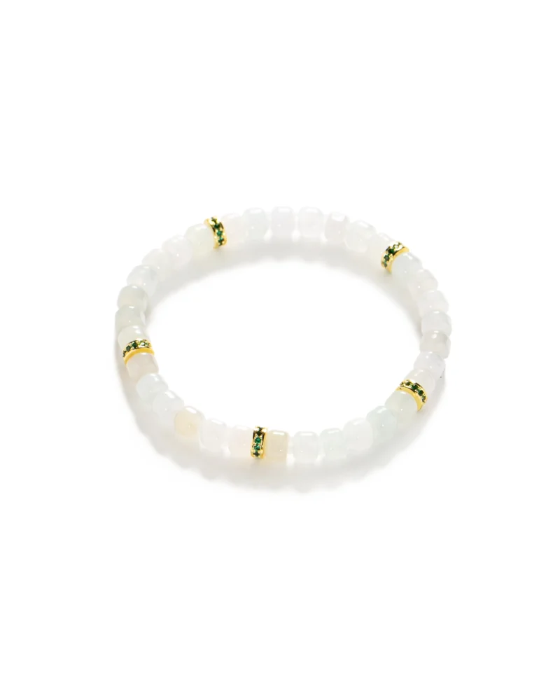 The Light Green and White Jadeite Bracelet features translucent white carved beads, accented with four evenly spaced gold-tone spacer beads adorned with small green gemstone details. The bracelet is displayed flat on a white background.