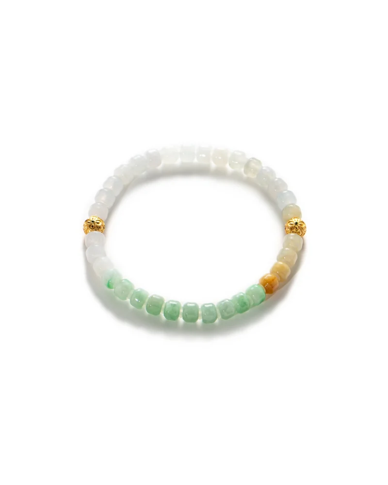 The Brownish-Yellow, Light Green and White Jadeite Bracelet showcases intricately carved beads in soft hues, complemented by gold-tone accent details and elegantly arranged on a white background.